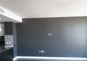 dark grey accent wall in kitchen dining area