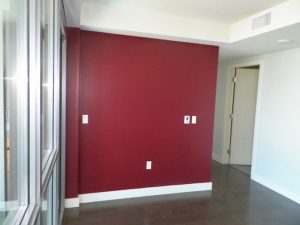 interior with maroon red accent wall
