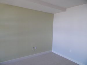 Bedroom with light sage accent wall