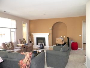 living room after with brown accent wall